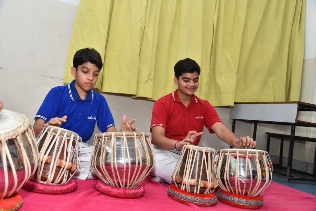 Students performing tabla arts at MKH Sancheti Public School Nagpur